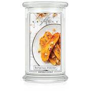 Kringle Candle Banana's Foster velika dišeča sveča z 2 stenjema (624 g)